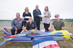 The Victoria Radio Control Modelers Society raised more than $24,000 at their recent air show in Central Saanich. From left: Dan Deringer, president of Santas Anon.; Christine Hewitt, executive director of Santas Anon.; Mike Scholefield of VRCMS; Gordon Benn, president of the board for the SPHF; Karen Morgan SPHF executive director, and; Jack Price of VRCMS. Steven Heywood